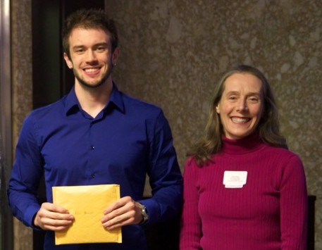 Book award presented to Eric Meunier, Masters student at Carleton University (L), with Prof. Claire Samson (R).