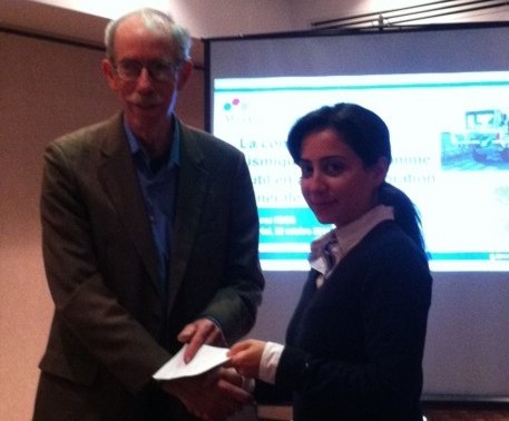 Jerry Roth, KF Chair (L), presents scholarship award to Yasaman Khajehnouri (R), PhD Candidate at École Polytechnique.