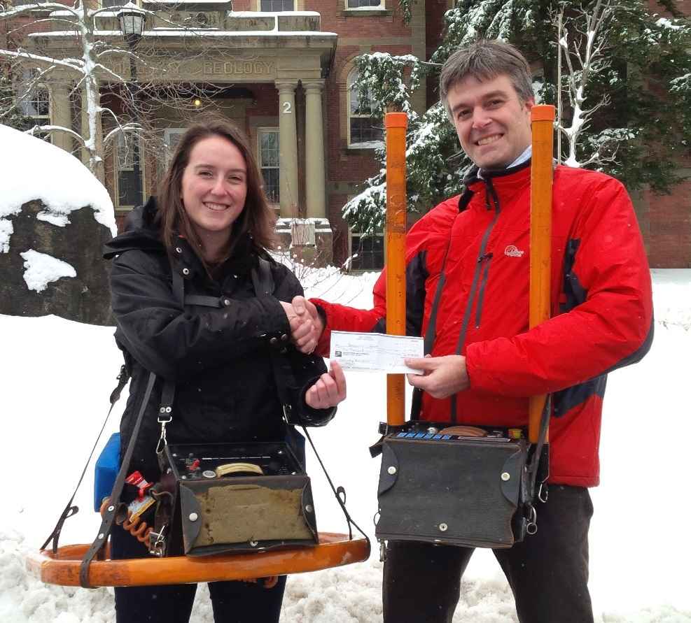 Jennifer Adam, 4th year undergrad at UNB, receiving award from Prof. Karl Butler (wearing MaxMin Tx and Rx, respectively)
