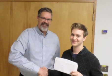 KEGS Scholarship recipient Luke Graves (R), UofT, congratulated by Stephen Reford (L), KF Vice-Chair, at January KEGS meeting.